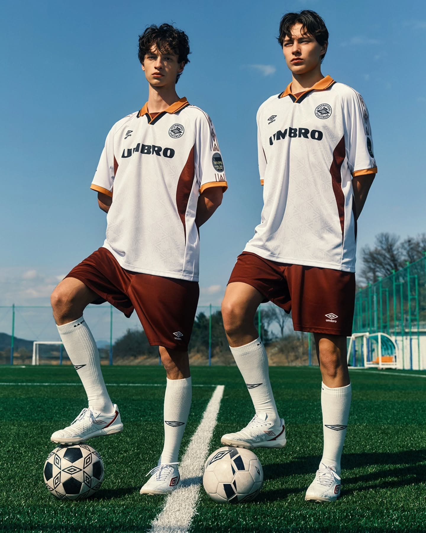 Synthetic player wearing a navy, red and white away shirt